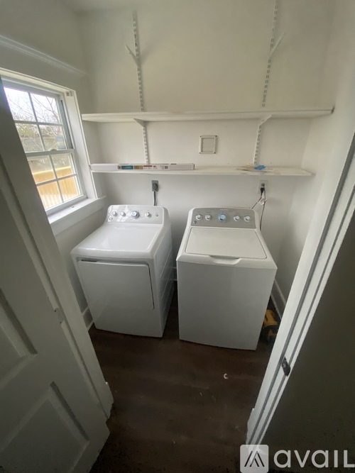 A laundry room with a washer and dryer.