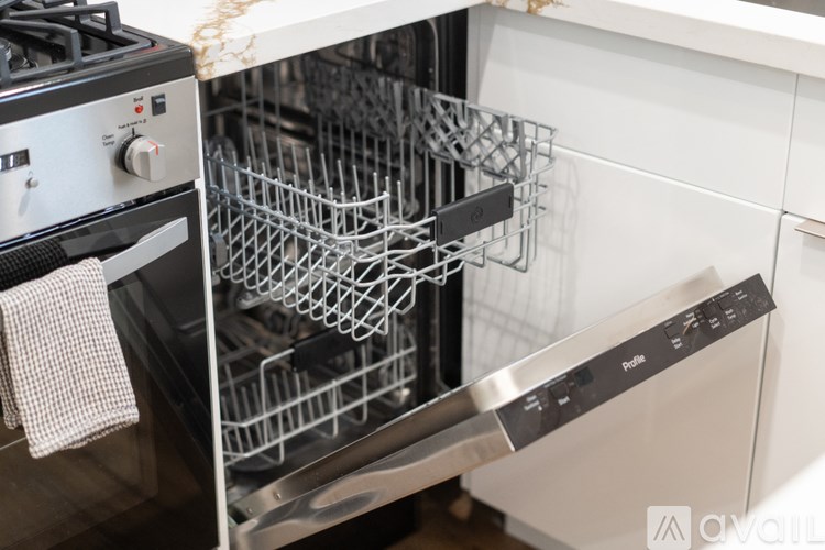 A modern kitchen with a stove and an oven.