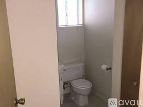 A small bathroom with a toilet and a sink.