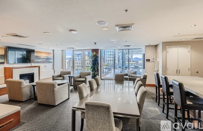 A conference room with a long table and chairs.