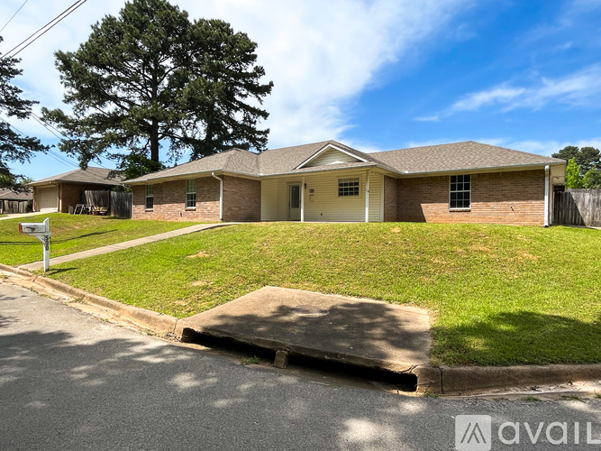 A house with a driveway in front of it.