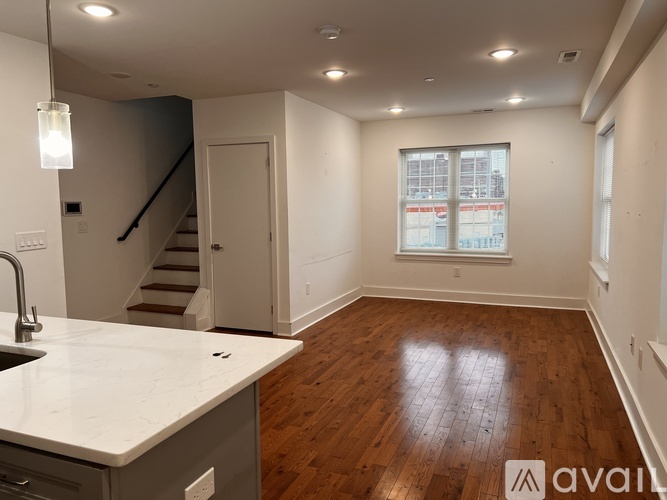 A kitchen with a sink and a window.