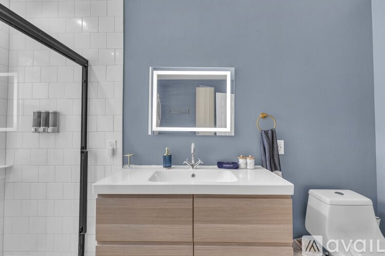 A patio with a round table and two chairs.