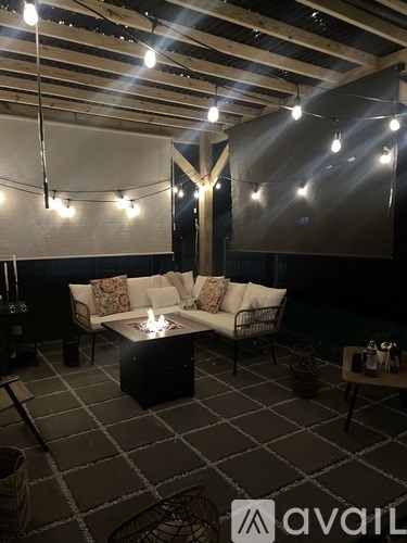 A modern living room with a black and white checkered floor.