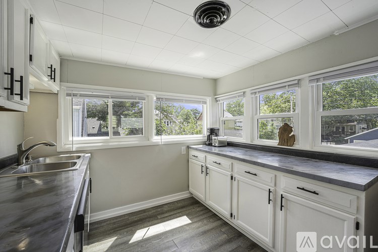 A kitchen with a sink and a window.