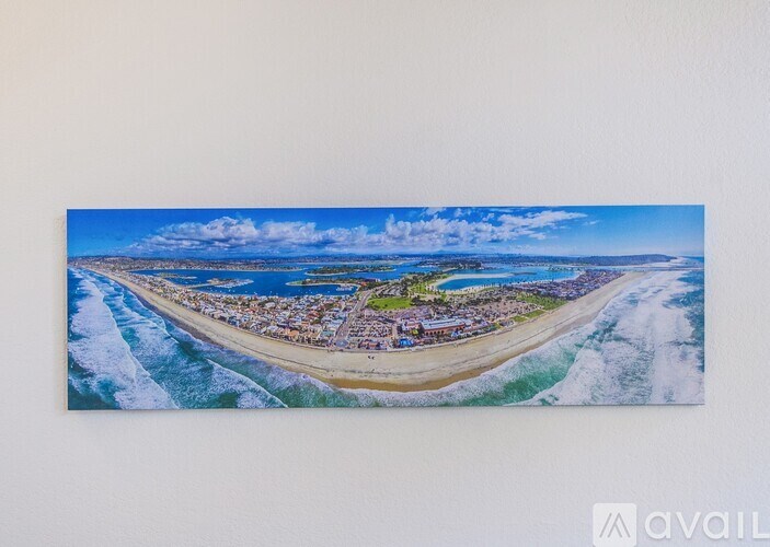 A beach scene with waves crashing on the shore.