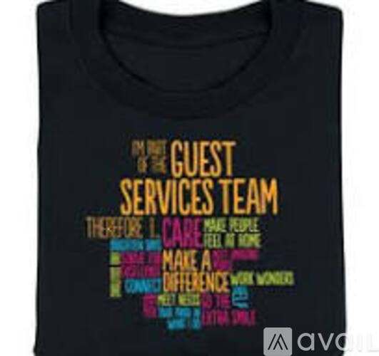 A black t-shirt with multicolored text that reads "The Guest Services Team.".
