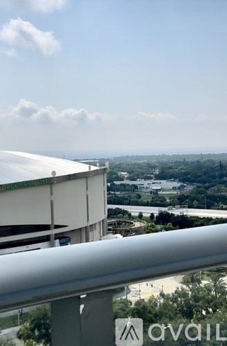 A view from a high vantage point looking down at a large building and a river below.