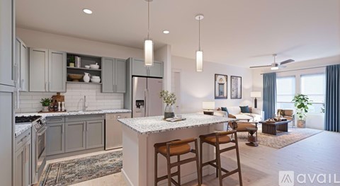 A modern kitchen with a bar area and a living room with a couch and a coffee table.