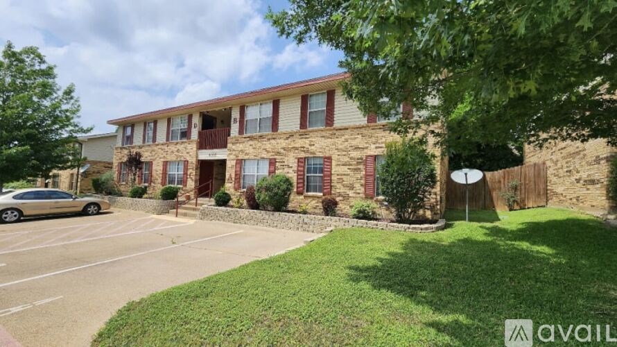 A building with a car parked in front of it.