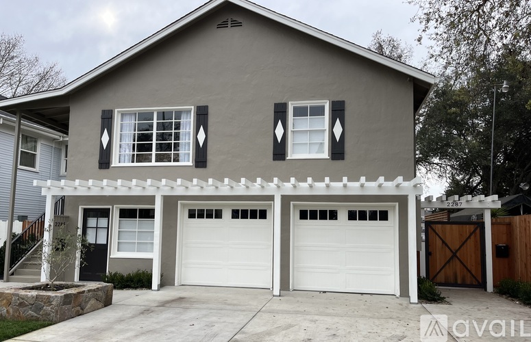 A two-car garage is attached to a house.