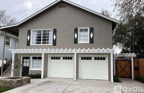 A two-car garage is attached to a house.