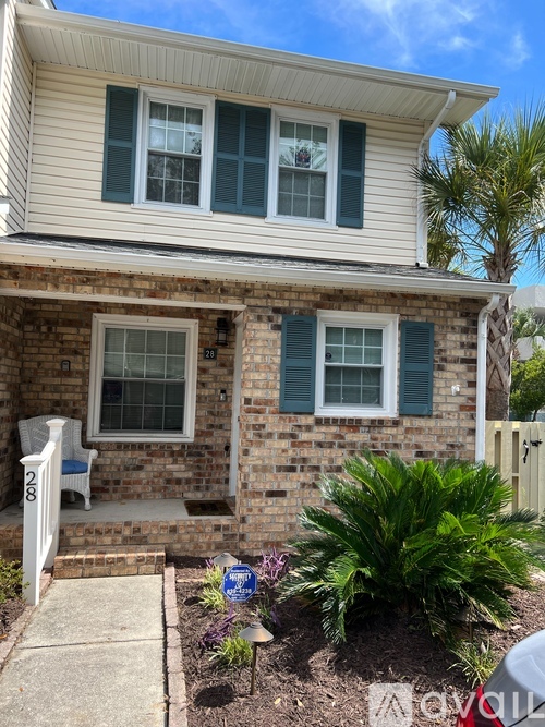 A house with a white porch and a white door.