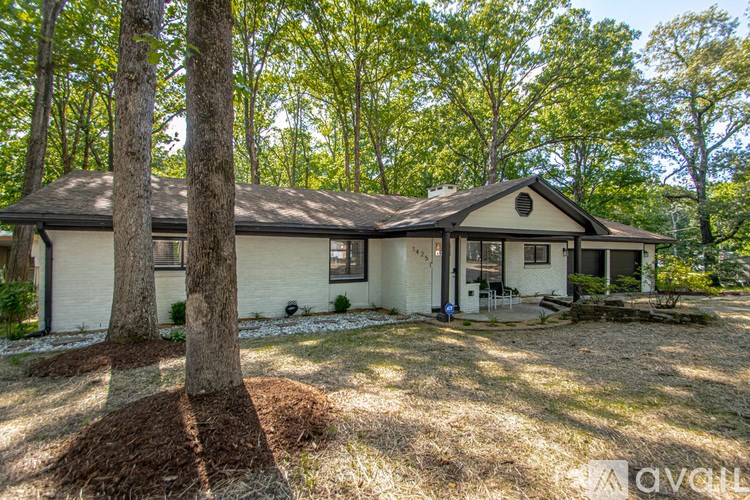 A house with a tree in front of it.