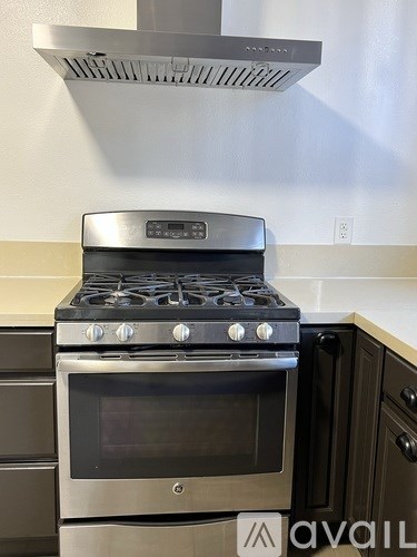 A modern kitchen with a stove and oven.