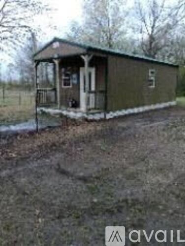 A small green building with the number 5 on it.