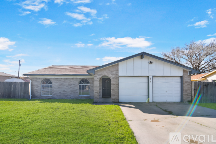 A house with a garage is for sale.