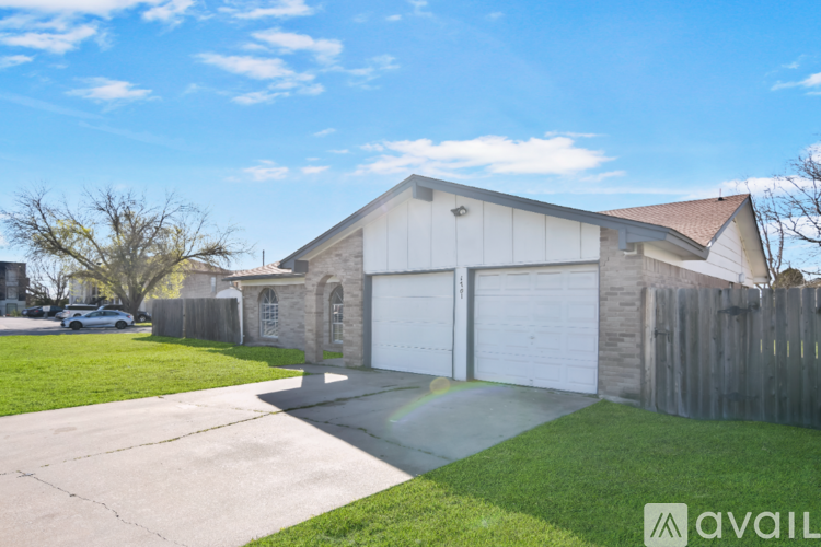 A house with a garage is for sale.
