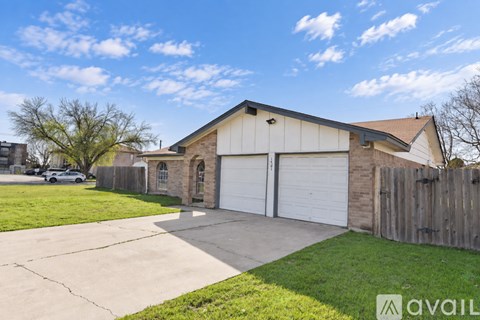A house with a garage is for sale.