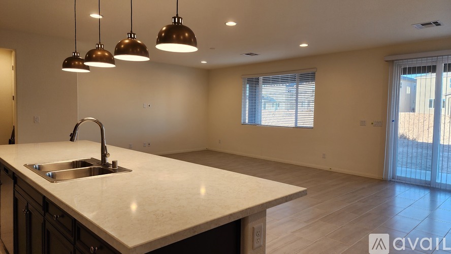 A spacious garage with a white wall and a white door.