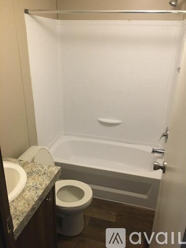 A white bathroom with a toilet and a sink.
