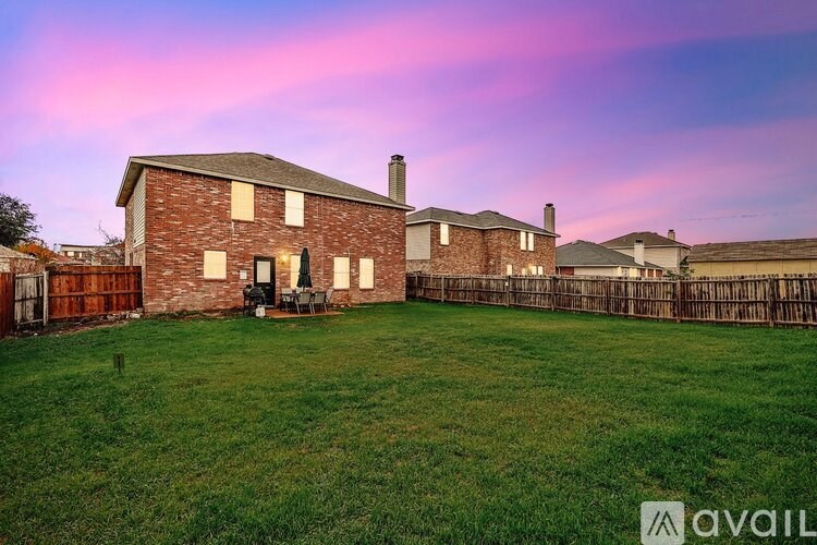 A house with a lawn in front of it is available for sale.