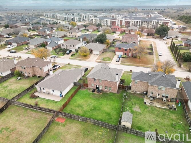 A bird's eye view of a residential area with houses and apartment buildings.