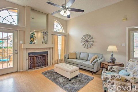 A living room with a fireplace and a couch.