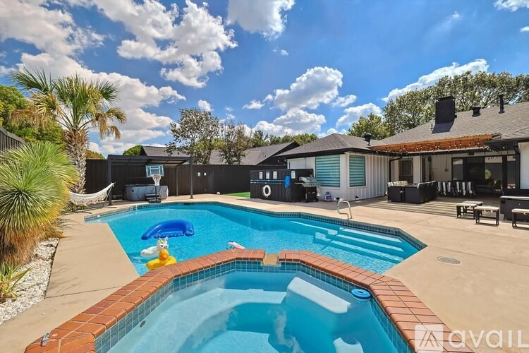 A pool with a blue inflatable duck in the middle of it.
