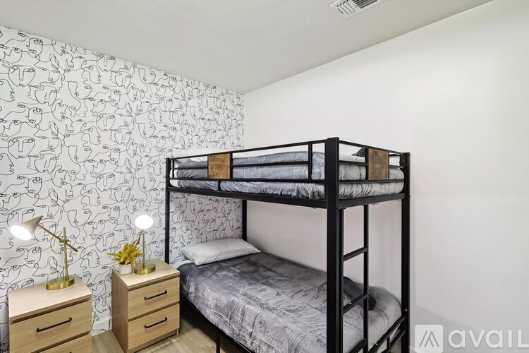 A bathroom with a white toilet, a white sink, and a white shower curtain.