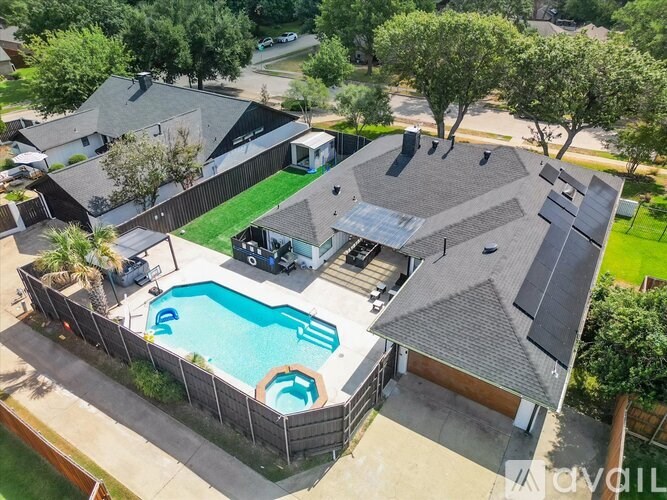 A house with a pool in the backyard.