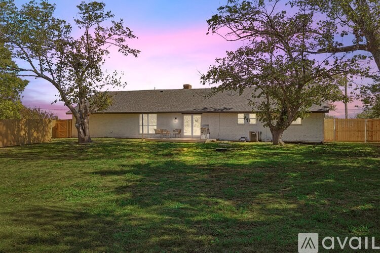 A house with a lawn in front of it.