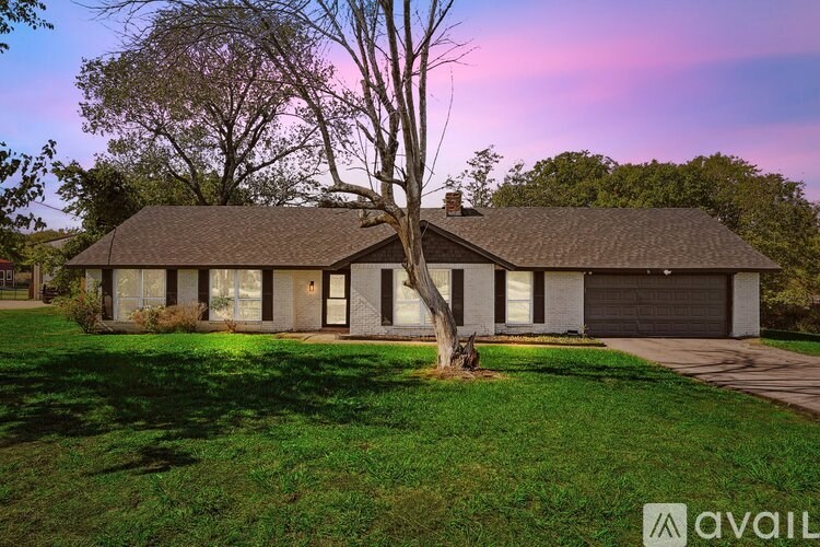 A house with a tree in front of it.