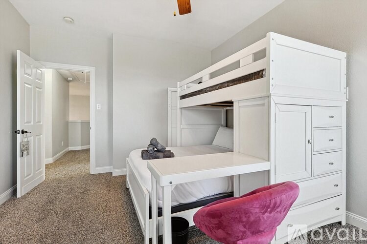 A bedroom with a bunk bed and a single bed.