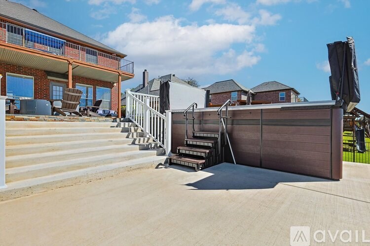A large outdoor speaker system is set up in front of a house.