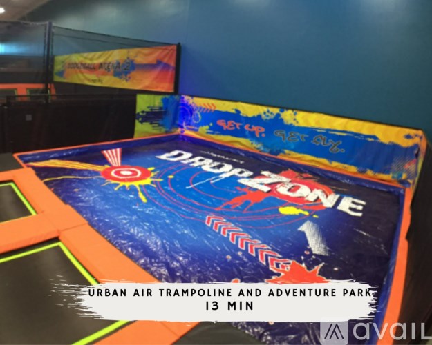 A trampoline with the words "Urban Air Trampoline and Adventure Park" on it.