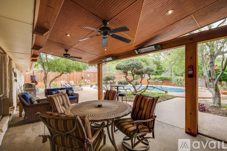 A patio with a table and chairs is available for rent.