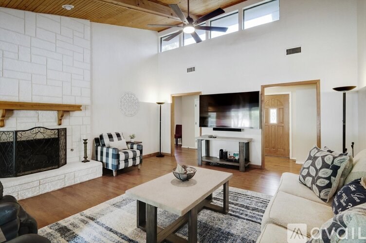 A living room with a fireplace and a couch.