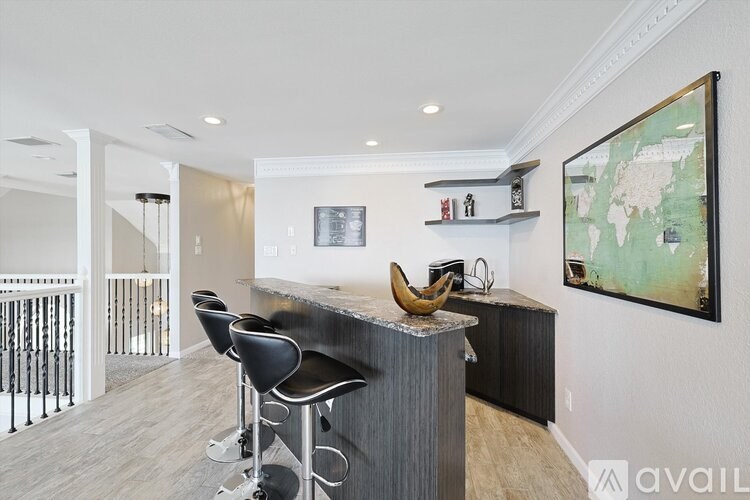 A bar area with a banana on top of the counter.