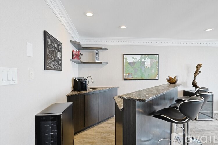 A modern kitchen with a dark wood finish.