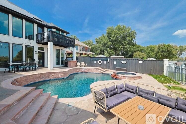 A modern house with a pool in the backyard.