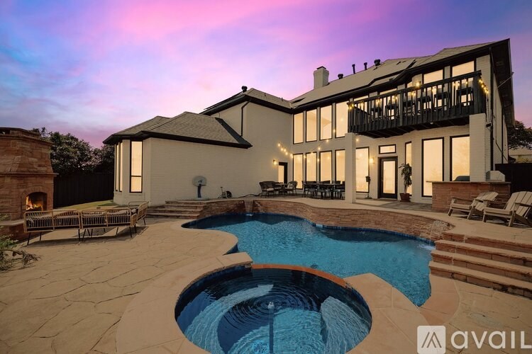 A large house with a pool in the backyard.