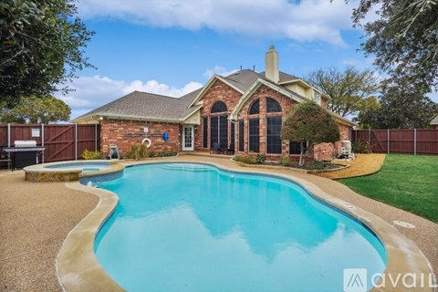 A house with a pool in the backyard.