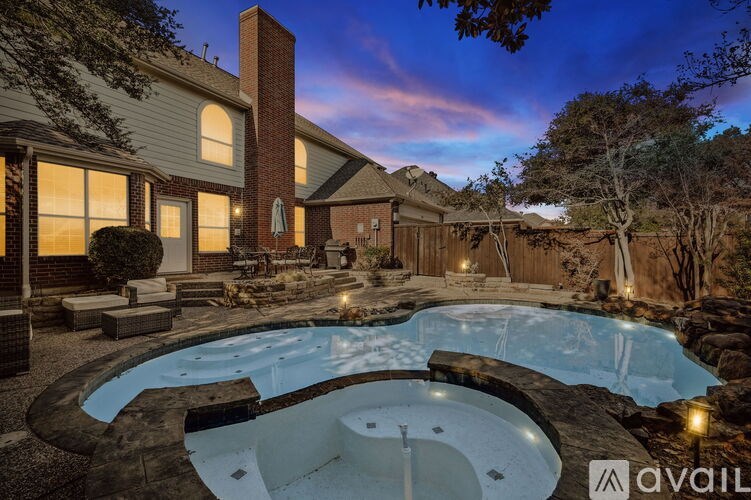A house with a pool in the backyard.