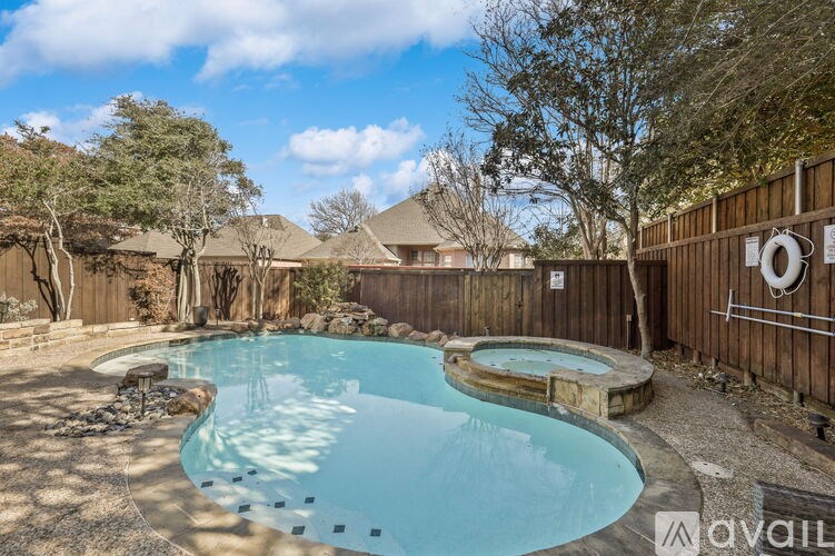 A pool with a hot tub in the middle of it.