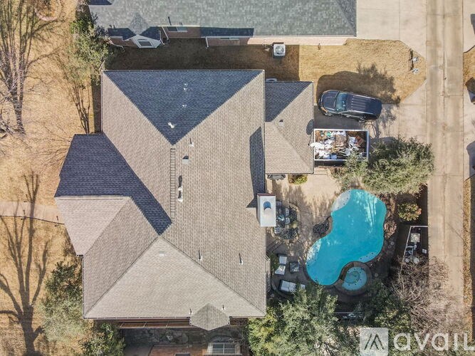 A house with a pool in the backyard.