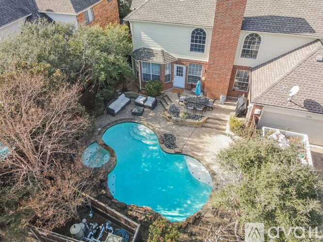 A house with a pool in the backyard.