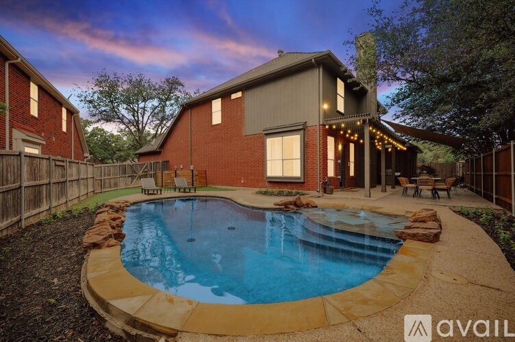 A house with a pool in the backyard.