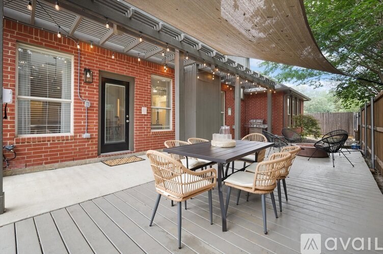 A patio with a table and chairs is available for rent.