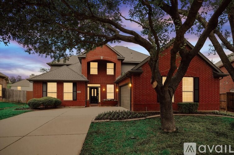 A house with a tree in front of it.